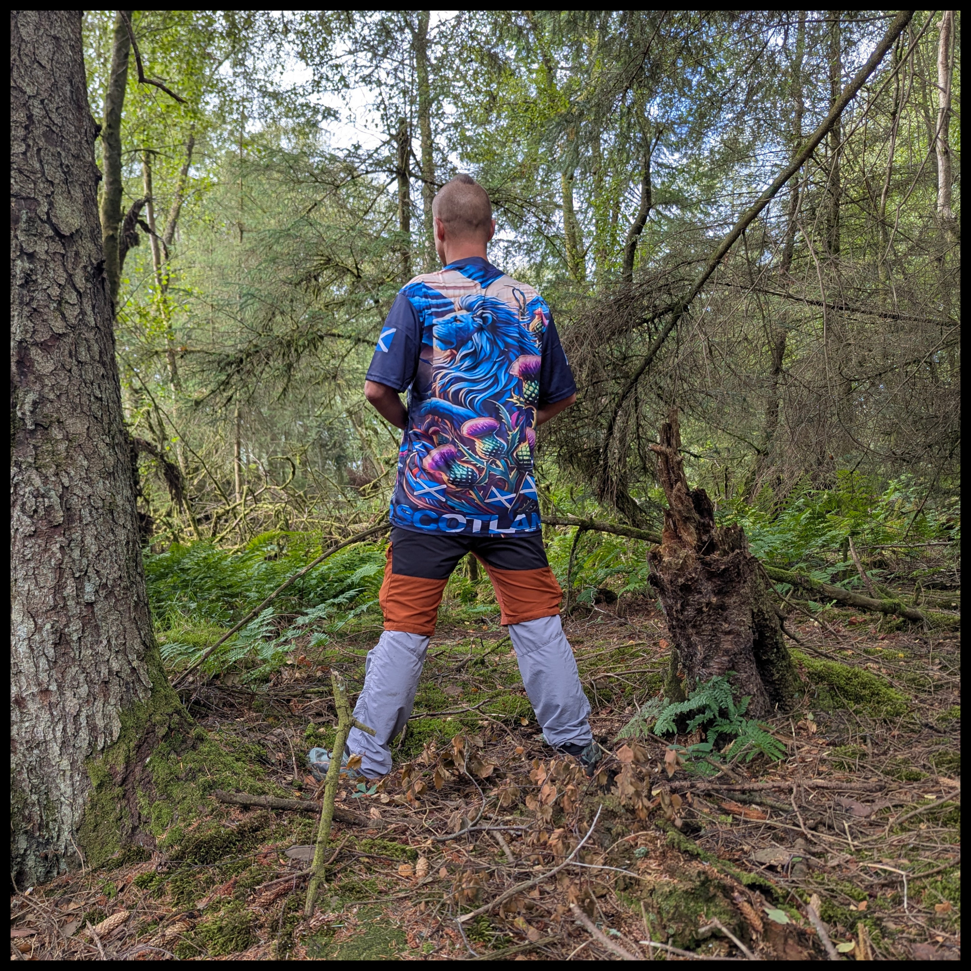 Munro Mental “Highland Lion” t-shirt – outdoor view in forest
