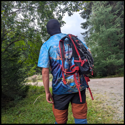 Munro Mental “Stag of Bravery” t-shirt worn on West Highland Way – outdoor back view with backpack
