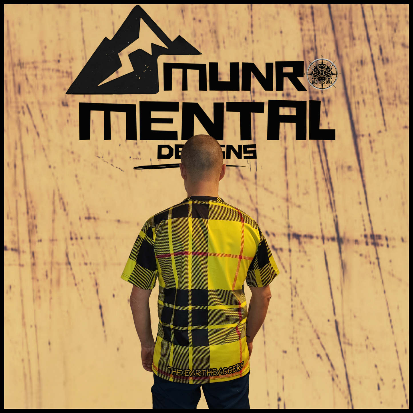 Munro Mental TShirt The Earthbaggers worn by model back view tartan pattern