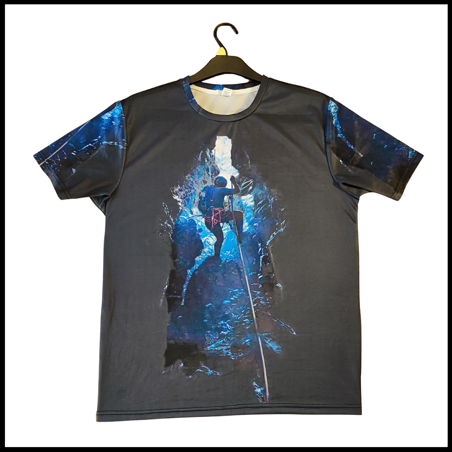 Munro Mental Tshirt The Cave front view with climber suspended inside dark cave
