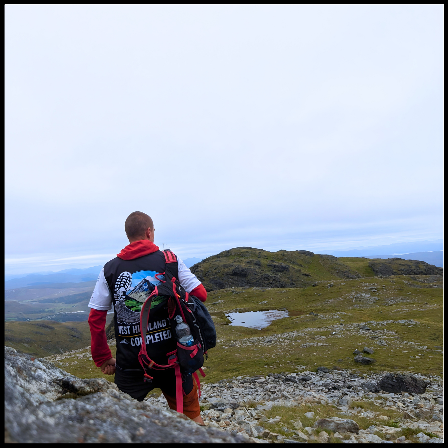 WHW Finisher t-shirt worn outdoors on West Highland Way trail back