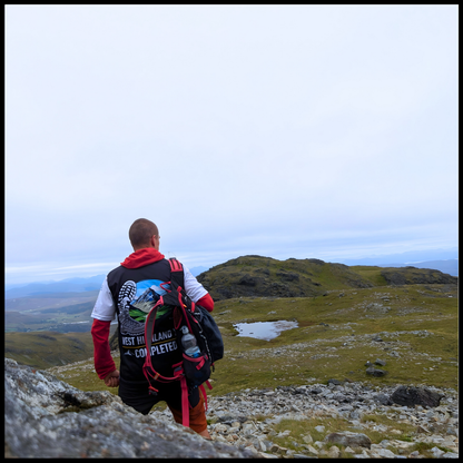 WHW Finisher t-shirt worn outdoors on West Highland Way trail back